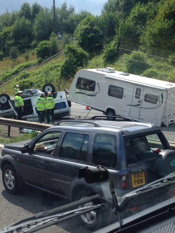 M56 Motorway Incident: Overturned Car, Paramedic Treatment Of Casualty M56 Motorway Incident: Overturned Car, Paramedic Treatment Of Casualty