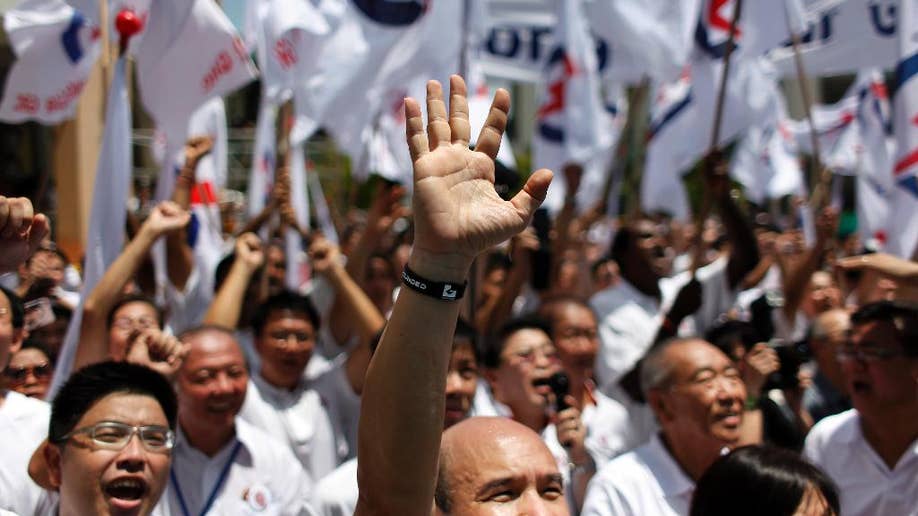 Singapore Votes: Ruling Party's Dominance Challenged Singapore Votes: Ruling Party's Dominance Challenged